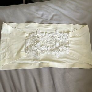 white tube top with flower detail in the back